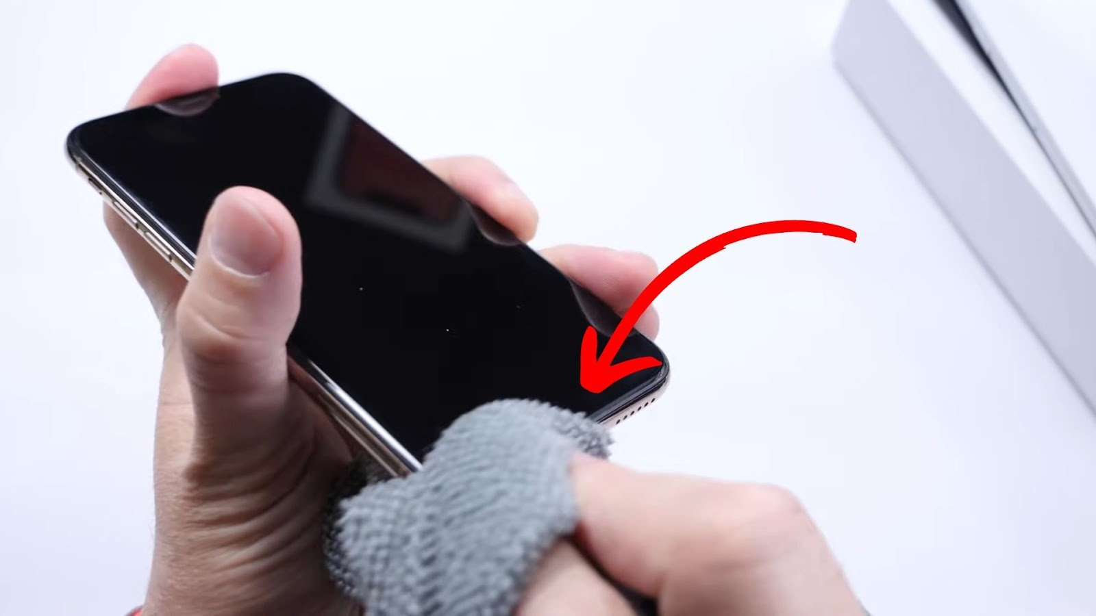 Step-by-step visual guide to cleaning an iPhone microphone using adhesive putty, soft brush, and alcohol, with warnings against compressed air and metal tools.
